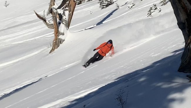 Chris Engelsman lays down a turn while testing The North Face's FutureLight outerwear